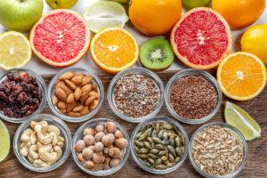 Assortment of colorful fresh fruits, nuts and seeds. Top view